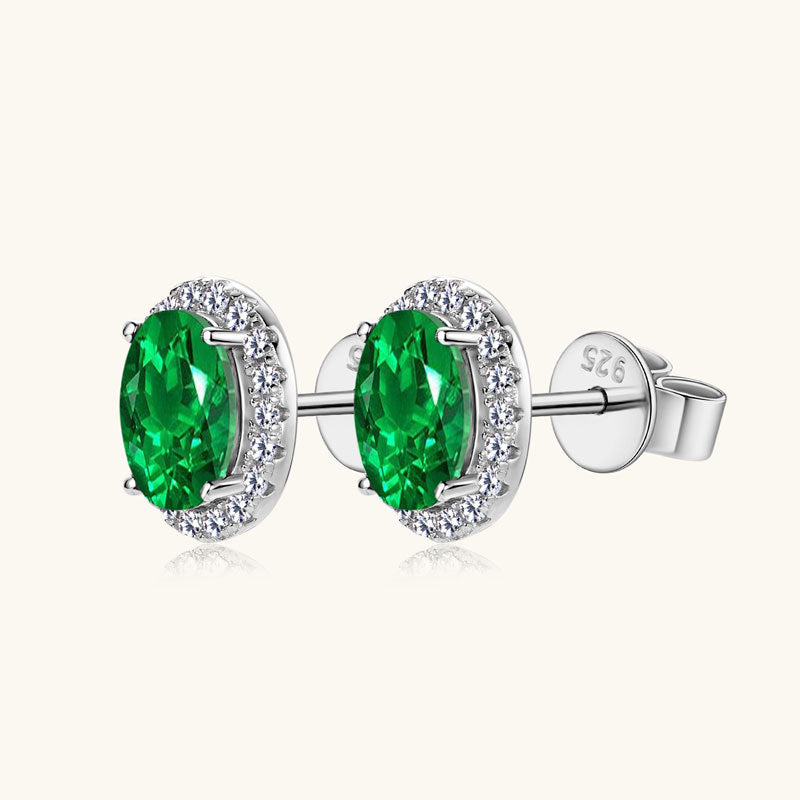 Elegant Oval Simulated Emerald Stud Earrings with Crystal Halo in Sterling Silver