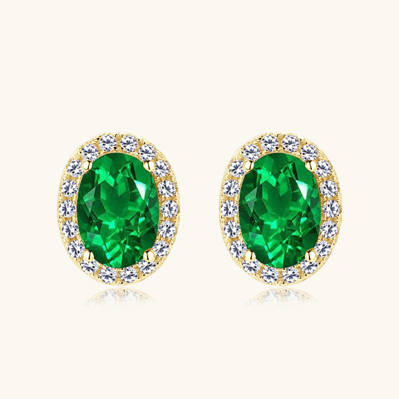 Elegant Oval Simulated Emerald Stud Earrings with Crystal Halo in Sterling Silver
